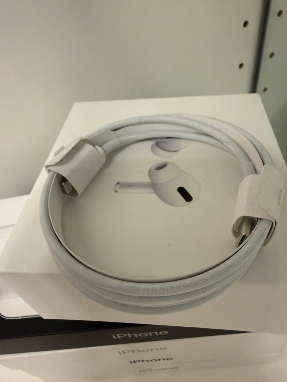 iPhone boxes andApple White Lightning Cable with USB Connector